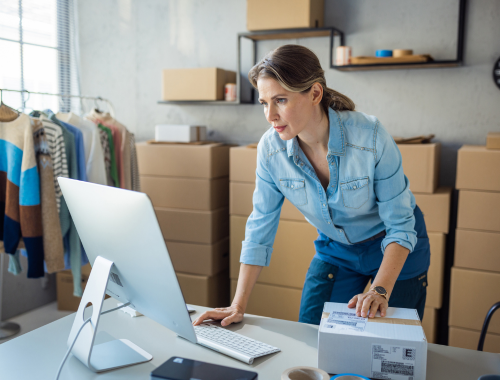 Woman standing at her desk